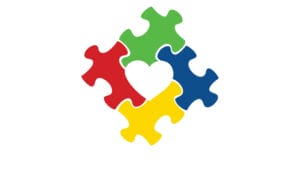 4 puzzle pieces, red, green, yellow and blue in a square with a heart in the middle representing Autism Awareness.