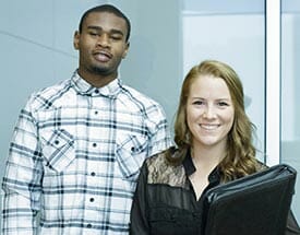 Two students dressed in business attire