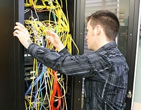 male student with computer wiring