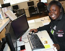 Female IT consultant sitting at computer