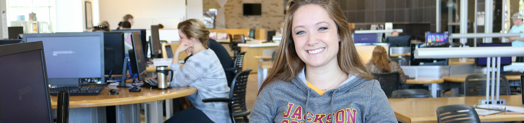 Female student sitting at computer