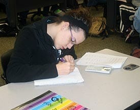 Girl writing in notebook