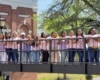 female students on bridge