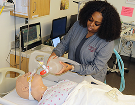 Male student at respiratory machine