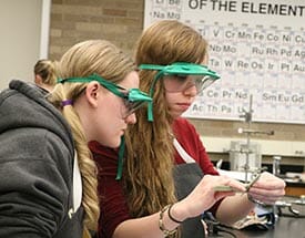 Two girls in a science lab