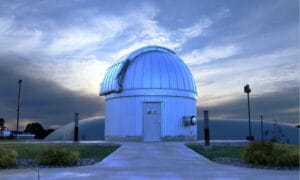 The Astronomical Observatory located on Jackson College Central Campus with a beautiful sky behind it.