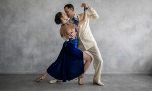 A couple ballroom dancing together.
