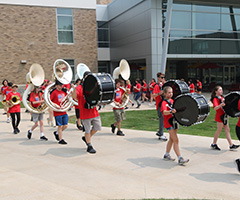 band campers marching on campus