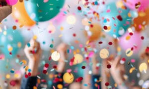 celebration scene with confetti and balloons