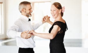 A couple doing east cost swing dancing, a form on ballroom dancing.