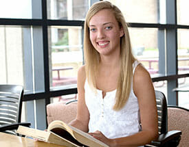 female student in library