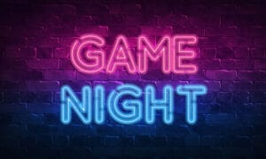 The words Game Night in neon pink and blue on a black background.