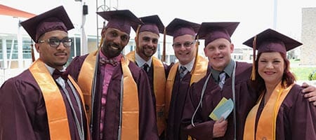 commencement students in cap and gown