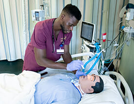 Female nursing student at mannequin