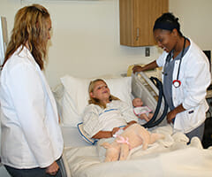 respiratory care students with young patient