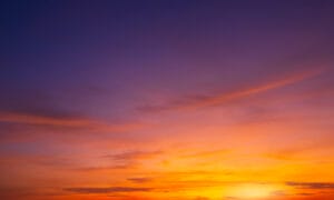 A purple and orange sky at sunset.
