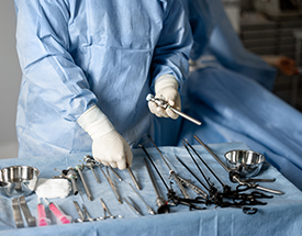 woman in surgical gown and equipment