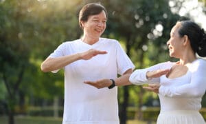man and woman doing tai chi