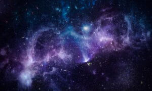 An image of the dark sky with purple galaxy and stars